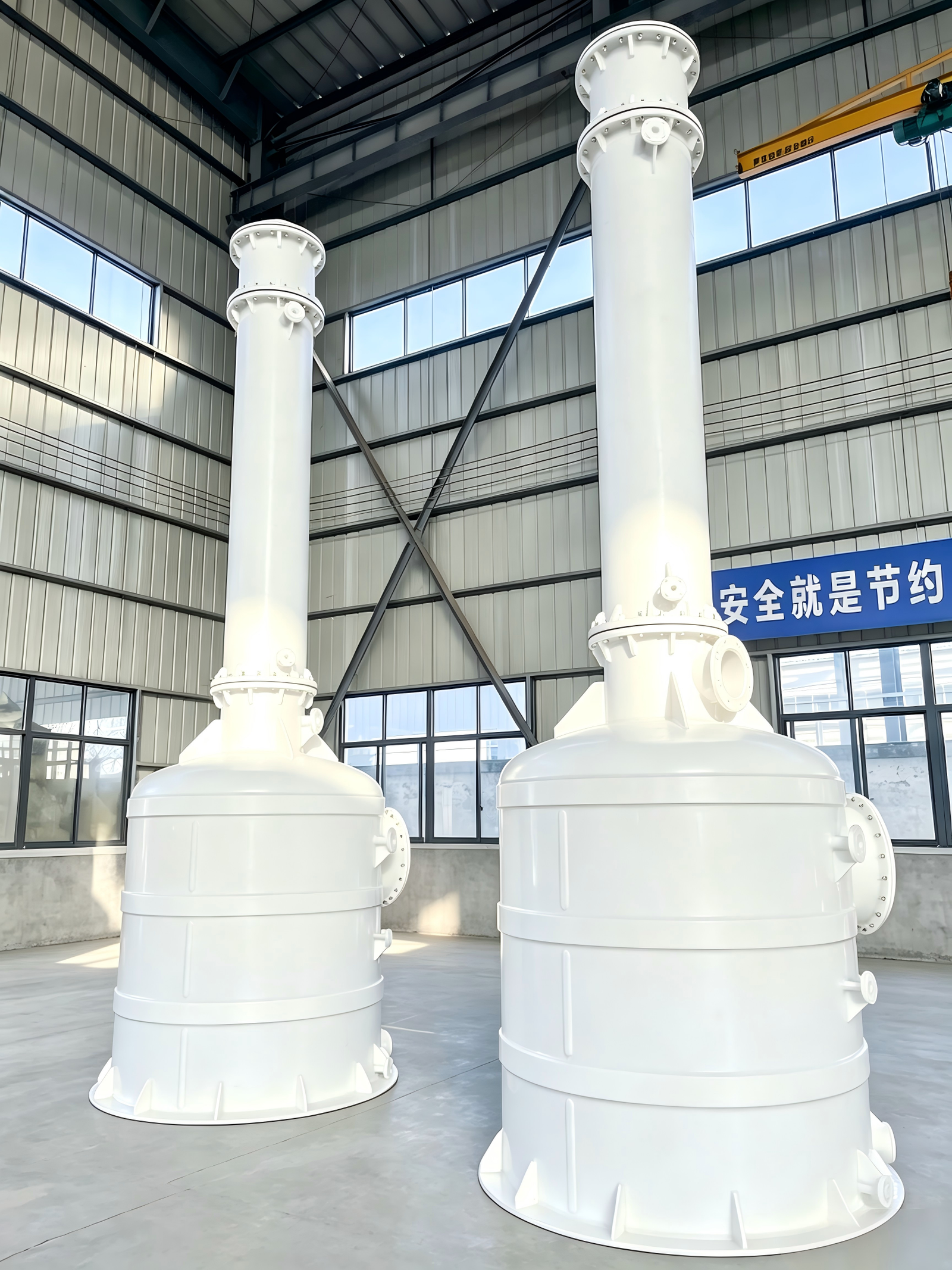 Industrial falling film absorber system with integrated recirculation tank for acid gas treatment