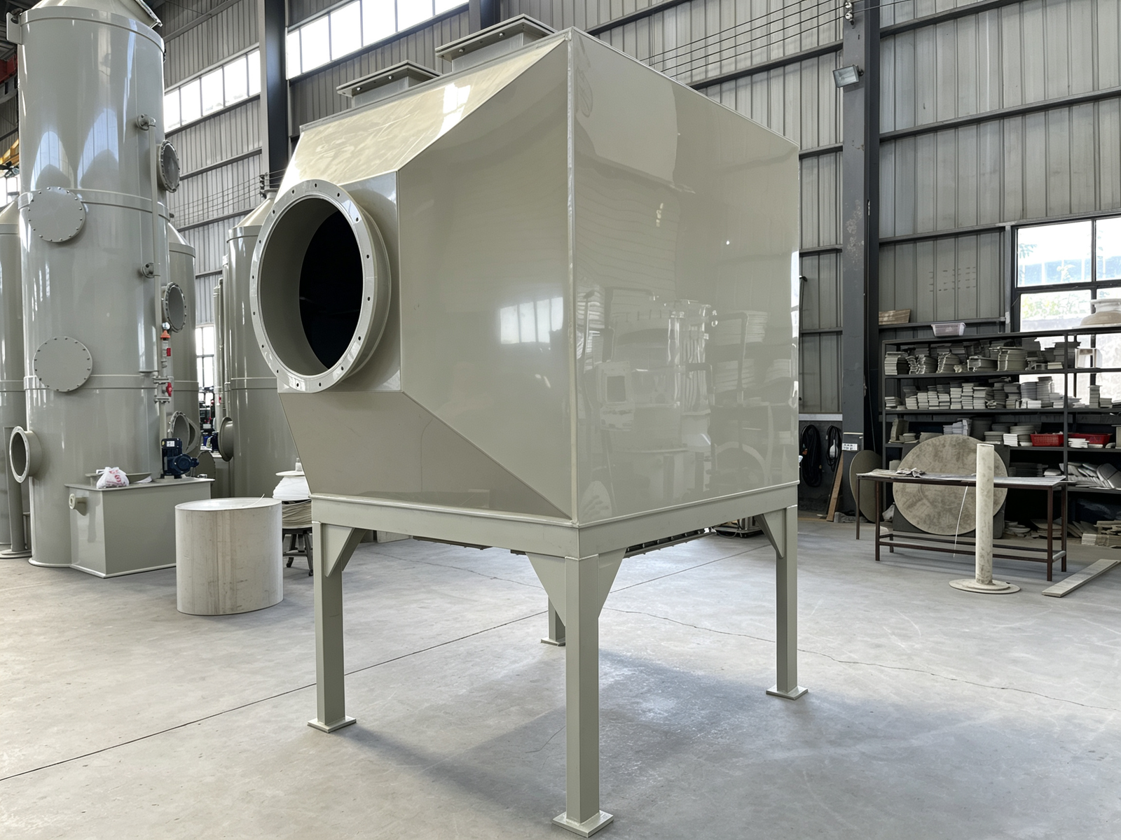 Vertical top-feed bottom-discharge activated carbon adsorber with granular carbon bed for industrial exhaust