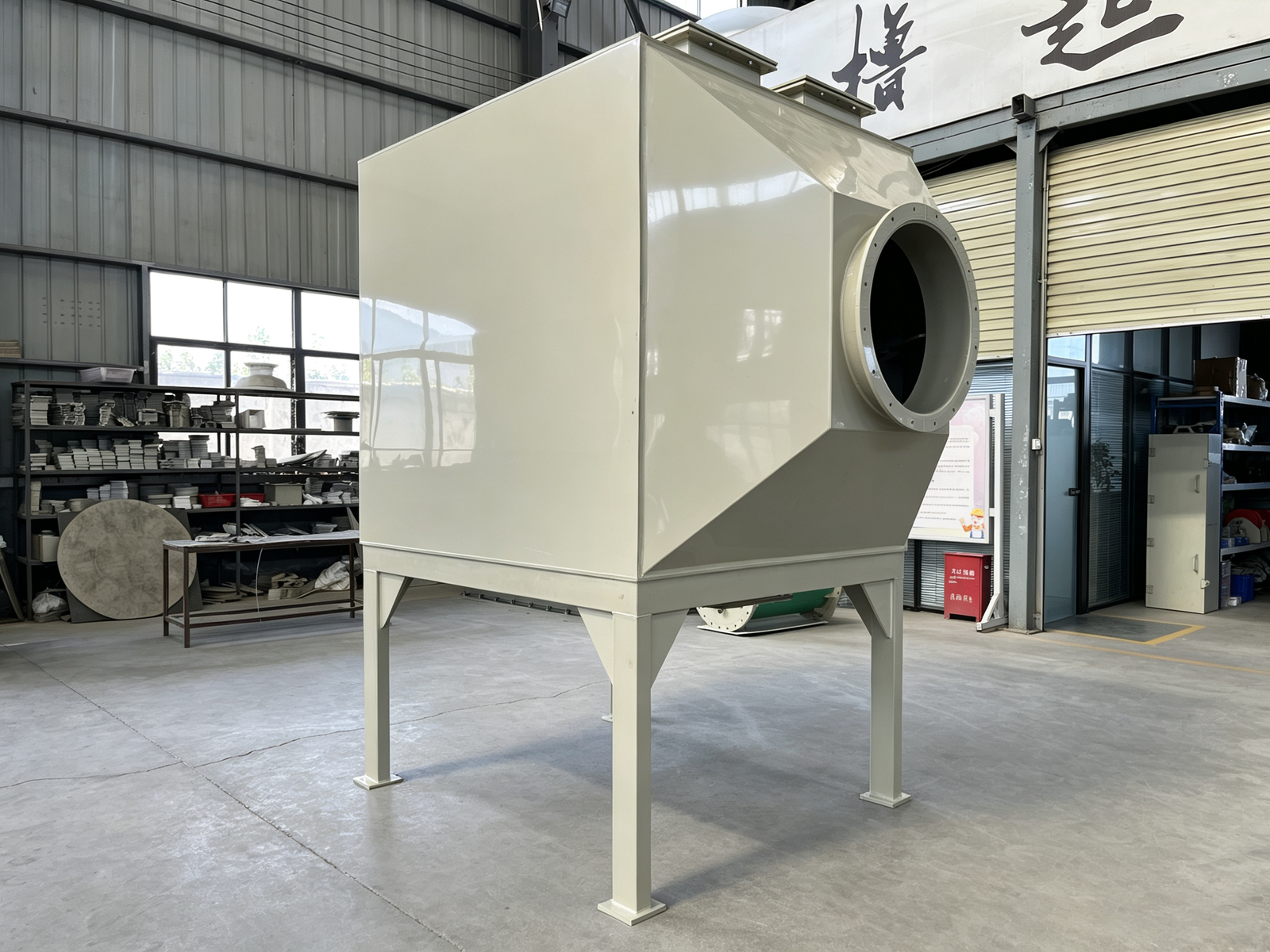 Vertical top-feed bottom-discharge activated carbon adsorber with granular carbon bed for industrial exhaust